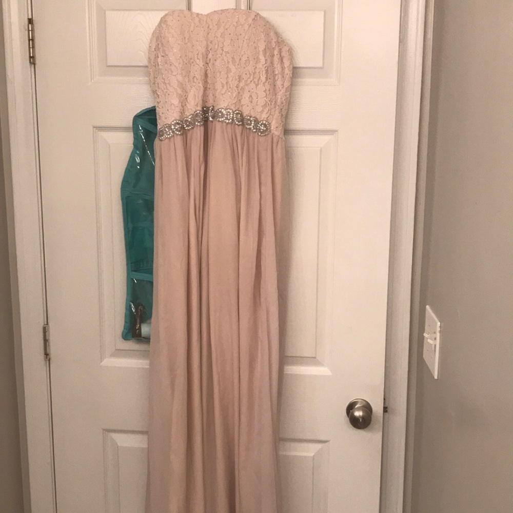 Cream formal dress with beautiful details.